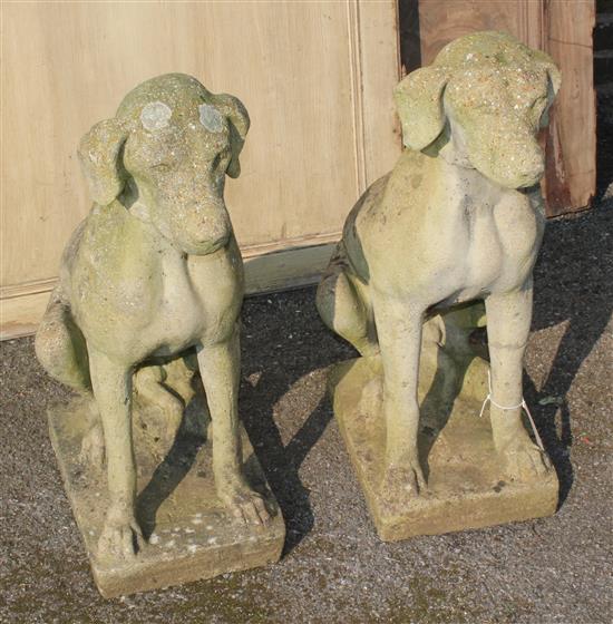 Pair reconstituted stone garden figures of seated hounds